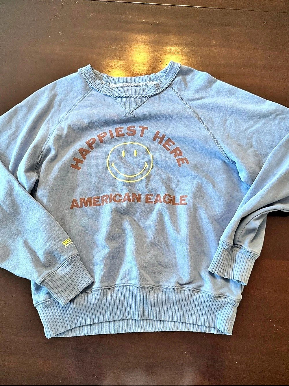 American Eagle Happiest Here Smiley Crewneck Sweatshirt in Blue